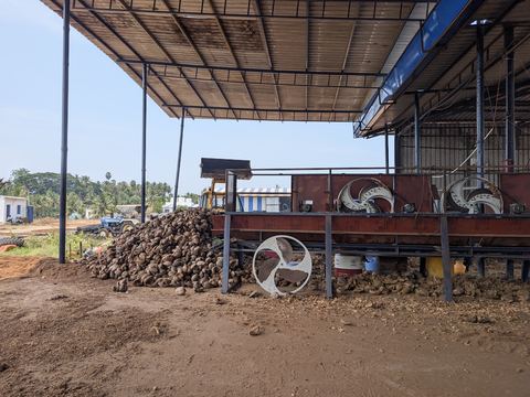 Coir husk moving through the chip-cutting machine
